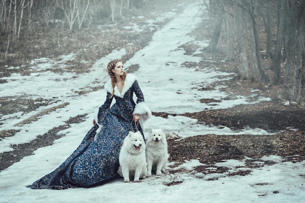 The woman on winter walk with a dog