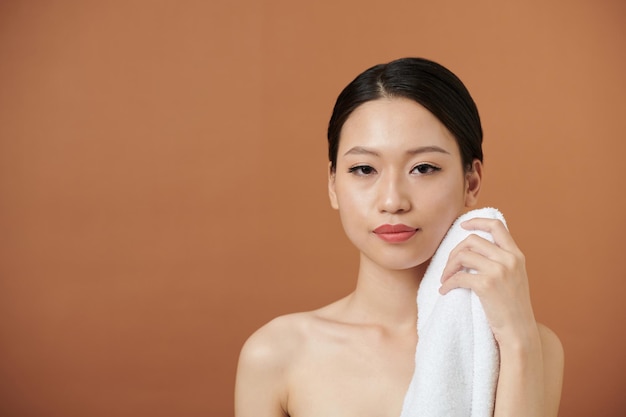 Woman wiping face and body