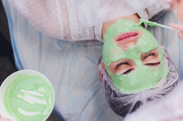 Woman with algae cream treatment for skin