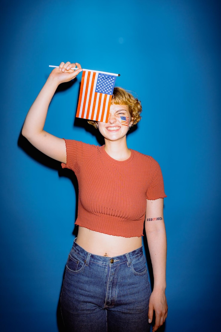 Photo アメリカ国旗を目の上に置いた女性