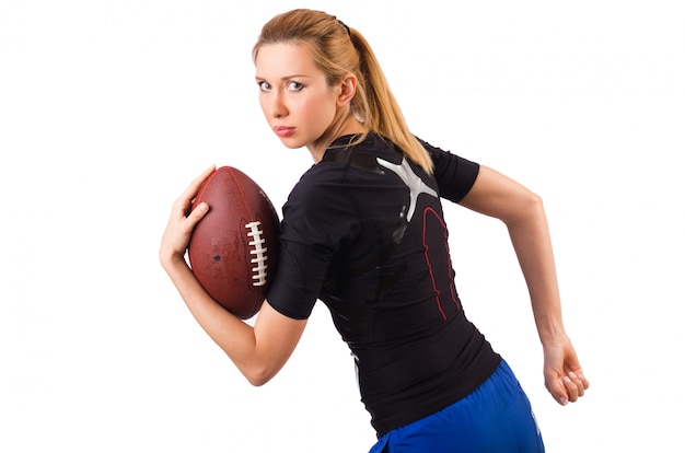 Woman with american football isolated on white