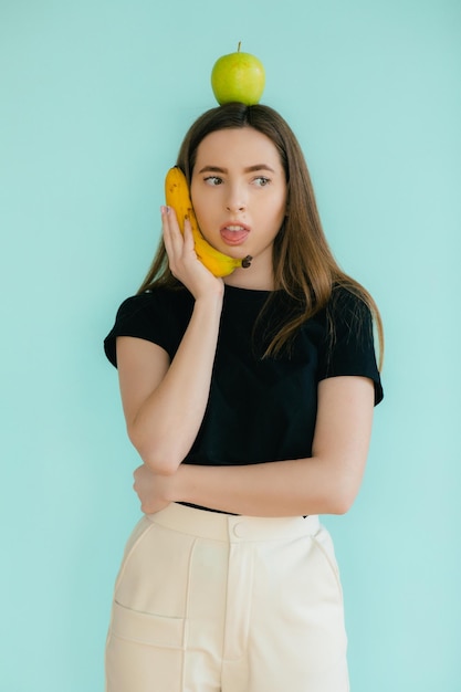 Woman with apple and banana