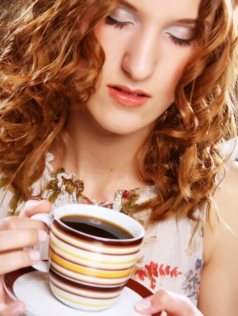 Woman with an aromatic coffee