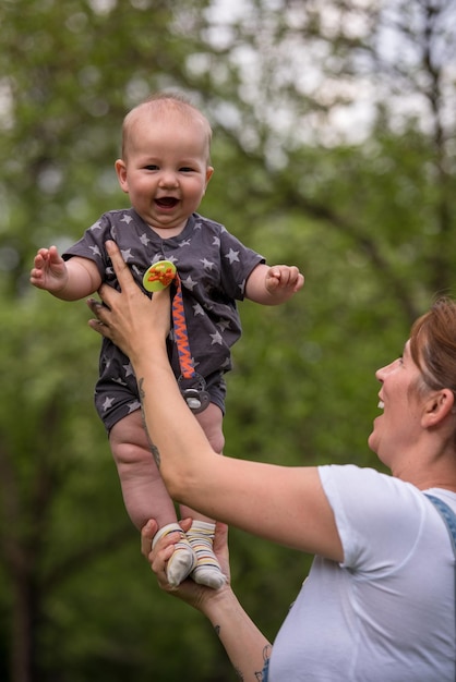 woman with baby have fun in nature