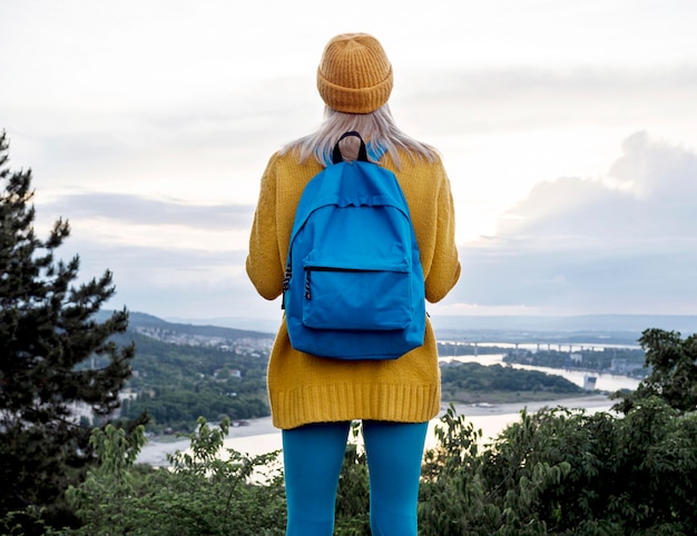 Woman with backpack  admiring view