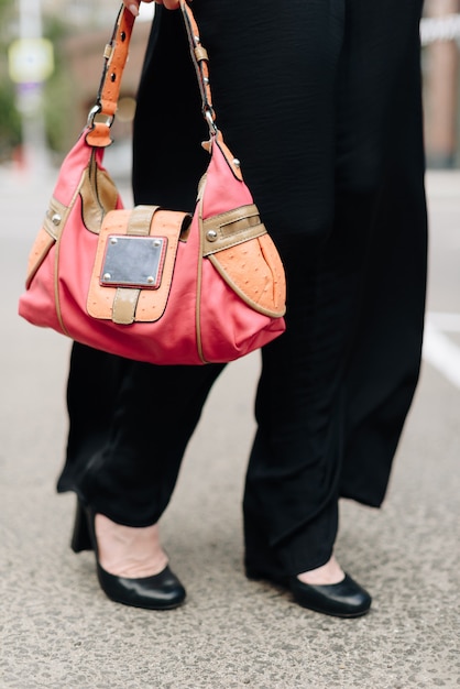 A woman with a bag on the background of the city