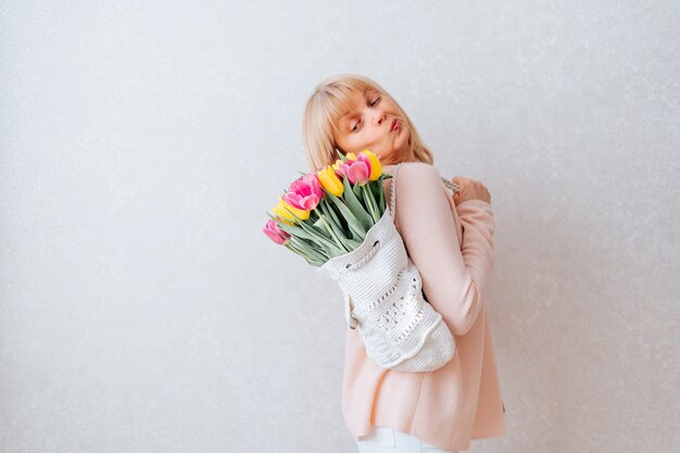 Woman with bag of tulips flowers