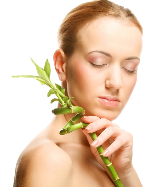 Woman with bamboo over white background