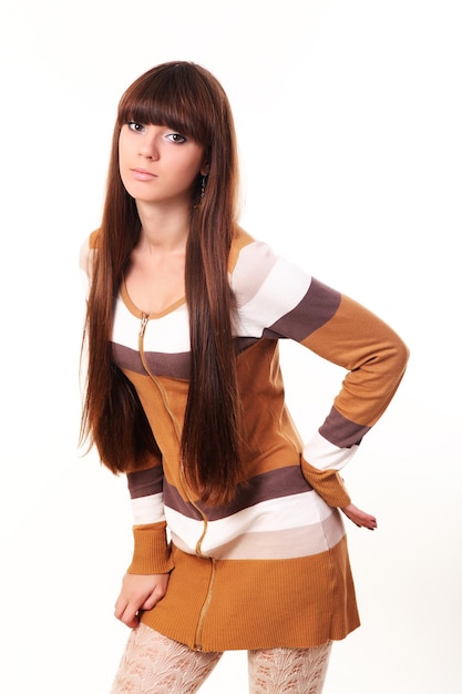 Woman with beauty long brown hair - posing at studio