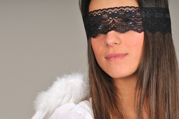 Woman with black lace blindfold ...