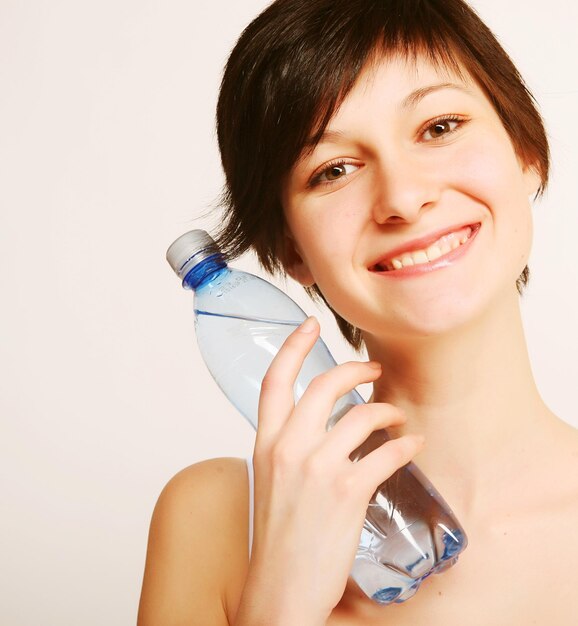 Woman with bottle of clean water