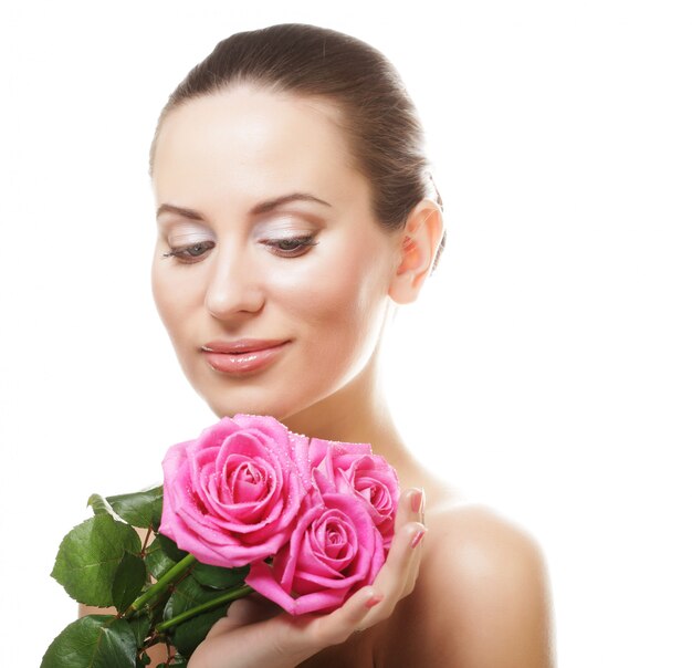 Woman with bouquet of pink roses