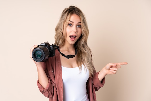 Woman with camera smiling