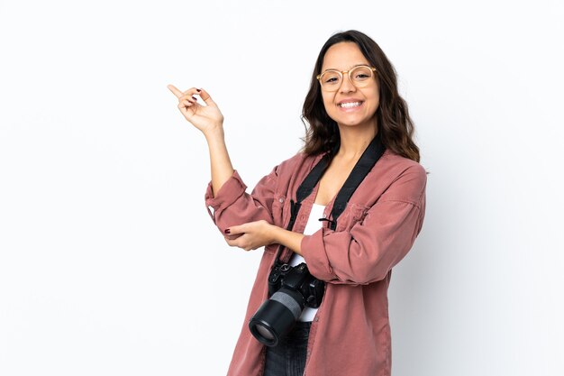 Woman with a camera in studio