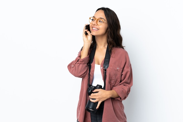 Woman with a camera in studio