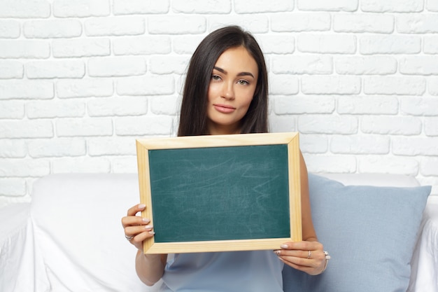 Woman with chalk board