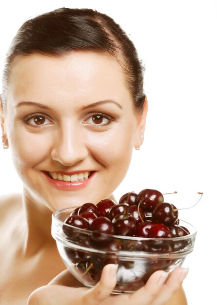 Woman with cherries over white