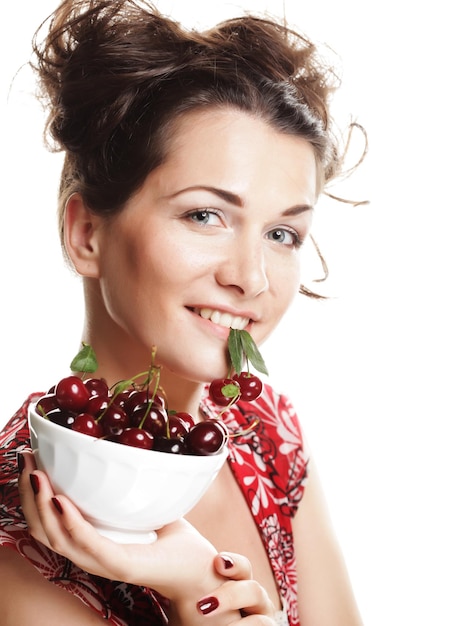 Woman with cherries over white