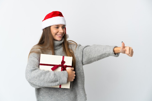 woman with christmas hat holding presents