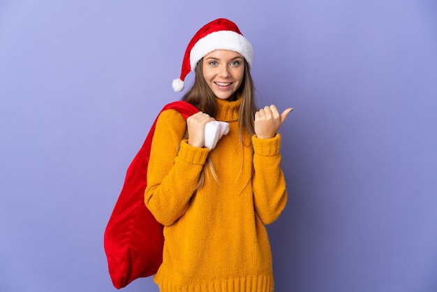 woman with christmas hat and santa bag