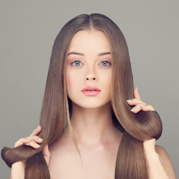 Woman with Clear Skin and Long Healthy Hairstyle