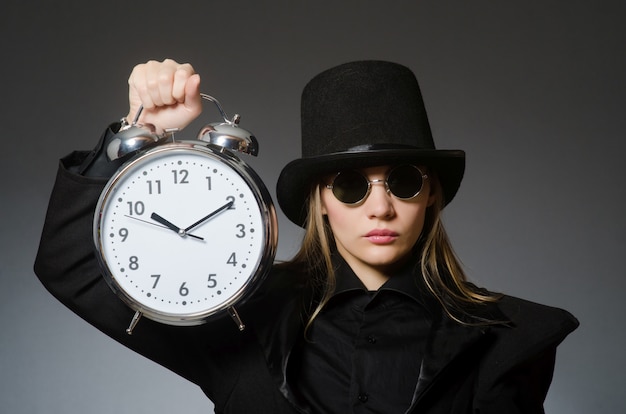 Woman with clock in business 