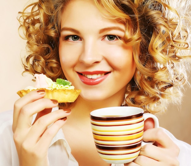 Woman with coffee and cookies