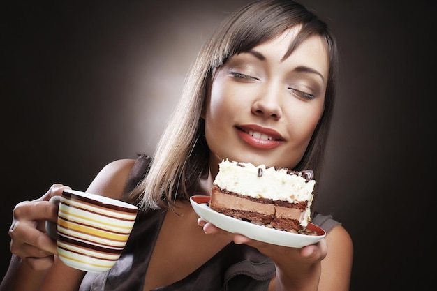 Woman with coffee and dessert