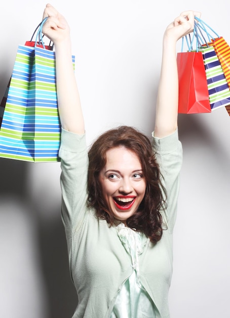 Woman with colored shopping bags