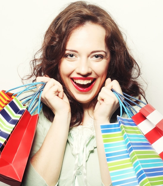 Woman with colored shopping bags