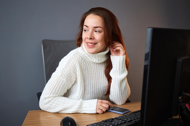 Woman with computer and smartphone work in office Small business