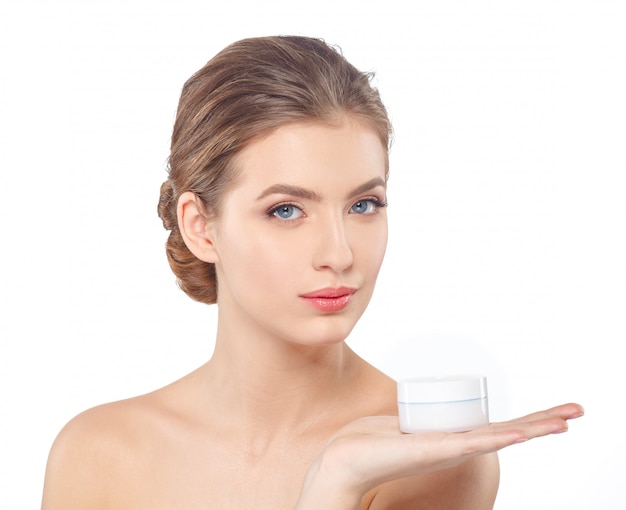 Woman with cream face skin care 