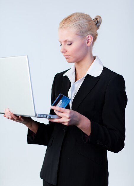 Woman with a credit card and laptop