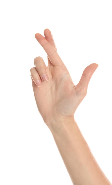 Woman with crossed fingers on white background closeup Superstition concept