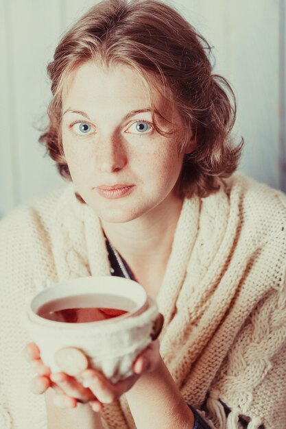 Woman with cup of tea