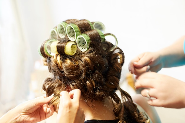 Woman with curlers on