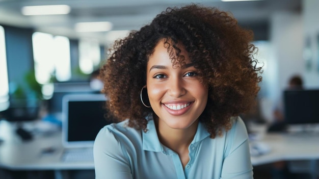 a woman with curly hair and a blue shirt is smiling