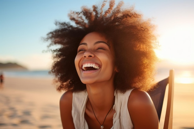 Woman with curly hair is smiling and laughing on beach