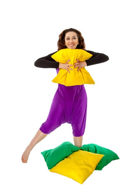 Woman with cushions on a white background