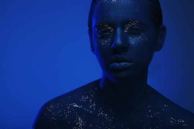 Woman with dark blue face