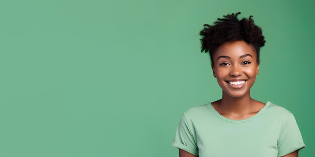 Woman with dark skin and short groomed hair isolated on flat green pastel background with copy space