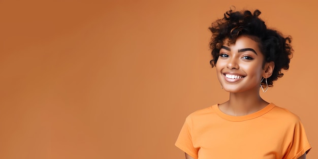 Woman with dark skin and short hair on flat orange bg with copy space for cosmetic beauty dentistry