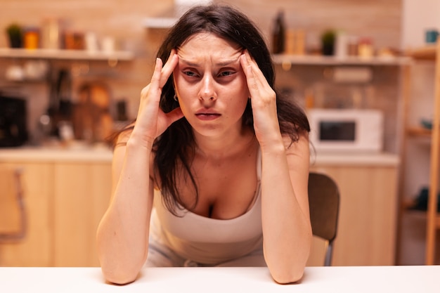 Woman with dizziness, Stressed tired unhappy worried unwell wife suffering of migraine, depression, disease and anxiety feeling exhausted with allergy symptoms