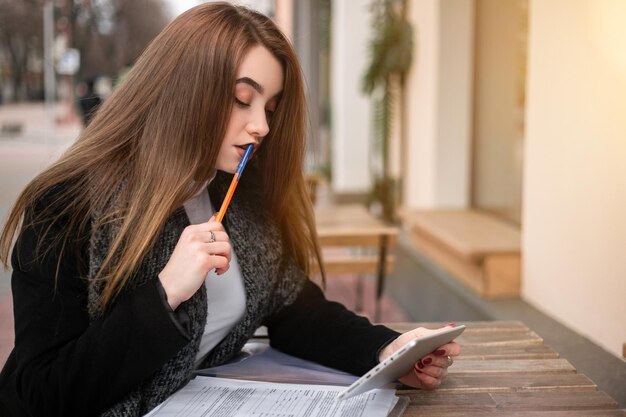 Woman with documents on the street