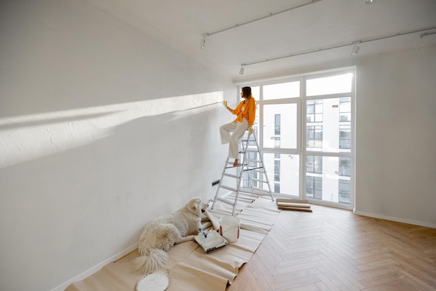 Woman with dog renovating house