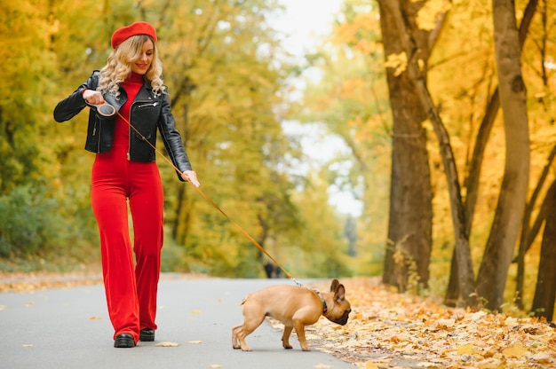 Woman with dog walking in the park