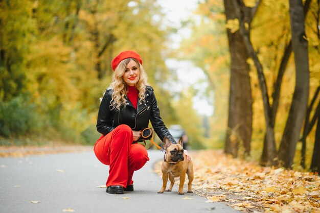 Woman with dog walking in the park