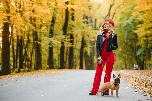 Woman with dog walking in the park