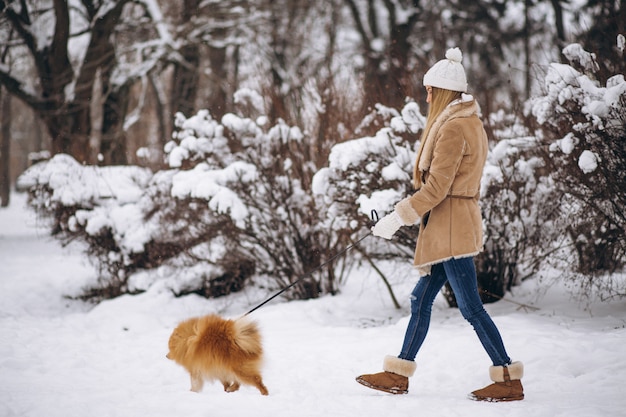 Woman with dog in winter