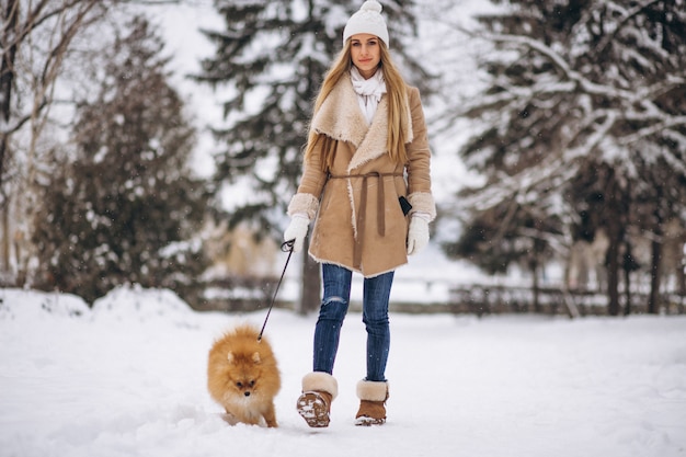 Woman with dog in winter